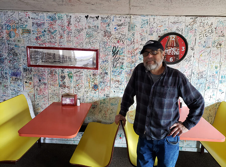 Kevin Muniz in the dining room of Poppa Al’s in Mill City. Muniz is putting the 66-year eatery up for sale.