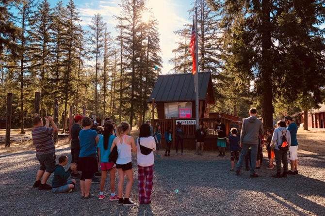 Campers at Camp Taloali take part in the morning flag ceremony.