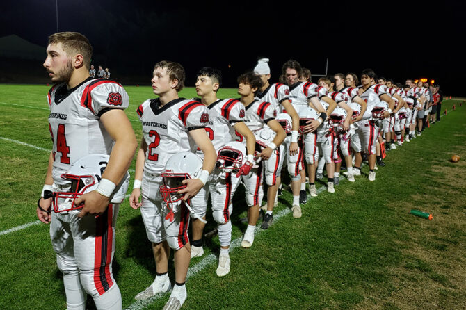 Trenton Stafford, far left, stands with his teammates for the national anthem in a game at Colton on Oct. 13. Stafford was named second-team all-league on offense as well as his first-team defense honor.