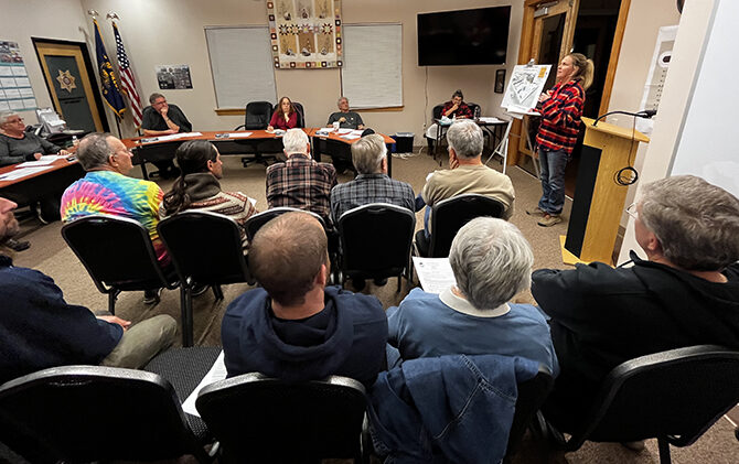 Danyel Scott (far right), co-owner of Dreamland Skateparks, updates the Mill City Council Feb. 28 on efforts to build a skatepark downtown. Stephen Floyd
