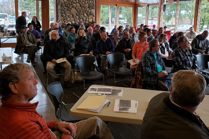 A crowd of approximately 50 people gathered at the Gates Fire Hall on Saturday, March 25, for a meeting about the Santiam Canyon’s wildfire recovery plan. At lower left are Councilors Denny Nielsen and Eric Page of Detroit. James Day
