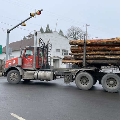 A logging truck makes a turn onto Highway 226 in Scio. ODOT is conducting an online survey on possible safety improvements in Scio, Lyons and Mill City. Submitted PHOTO