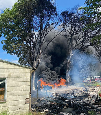 Spilled fuel burns after a tanker truck crashed east of Lyons May 23. Salem Fire Department