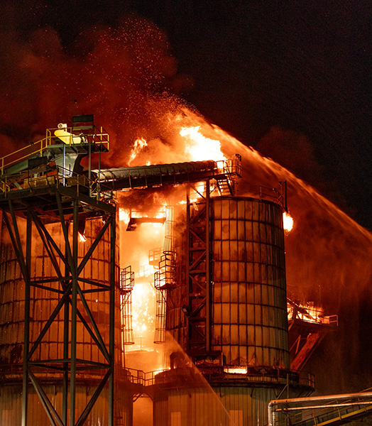 Firefighters battle a 2-alarm blaze Friday night at a Freres Engineered Wood facility in Lyons. Lyons Rural Fire Protection District