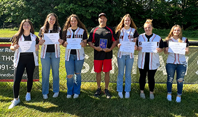 Santiam High softball all-district honorees, from left are: Boston Flores, Kasey Solus, McKenna Dodge, coach Greg Grenbemer, McKayla Dodge, Kielyn Thurston and Savannah Stanley. submitted photo