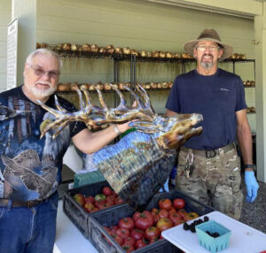 Artist Herman Friedan of “Metal Your Way” with farmer Bradley Matson. SUBMITTED PHOTO