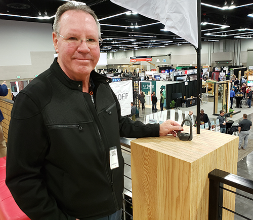Freres Engineered Wood President Rob Freres is shown next to a column built with the company’s mass plywood panels. The panels were used to build a lounge/viewing platform at a conference last March in Portland. James Day